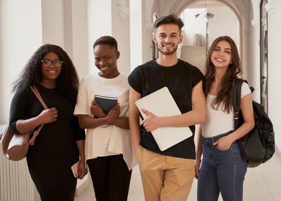 Happy Students With Backpacks.